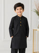 Young boy wearing a black Shalwar Kameez with yellow buttons