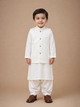 Child wearing a traditional white Shalwar Kameez with White Waistcoat